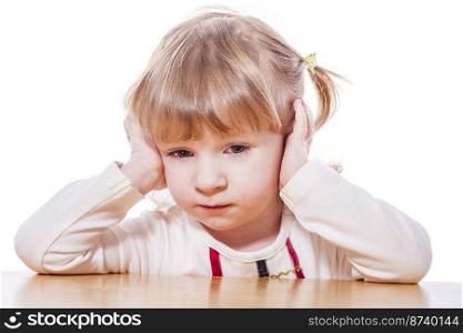 Close-up portrait of Pensive child isolated on white. Pensive little girl