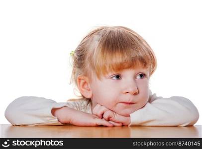 Close-up portrait of Pensive child isolated on white. Pensive little girl