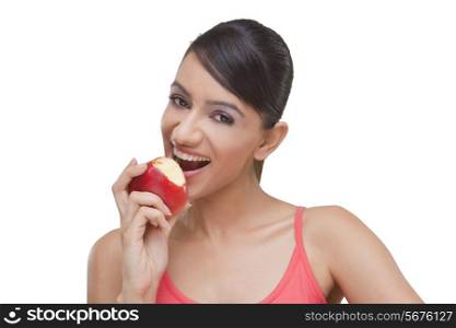 Close-up portrait of pretty woman with bitten apple