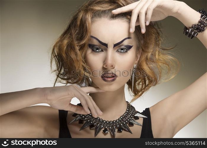 close-up portrait of pretty woman with crazy style, creative purple make-up and gothic accessories
