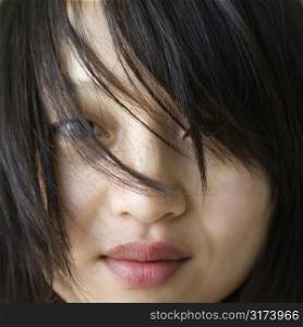 Close up portrait of pretty young Asian woman.
