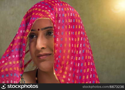 Close-up portrait of rural woman wearing sari