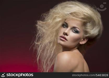 close-up portrait of sexy blonde woman with creative bushy hair-style and cute make-up