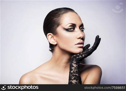 close up portrait of sexy brunette woman with glove
