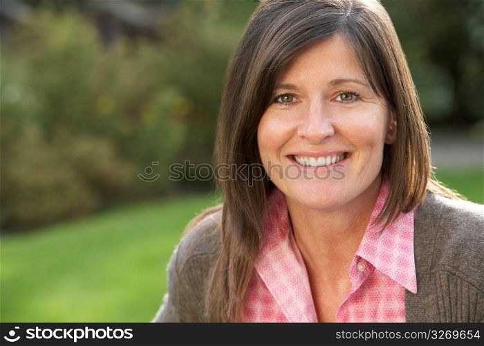 Close Up Portrait Of Smiling Brunette Woman Outdoors