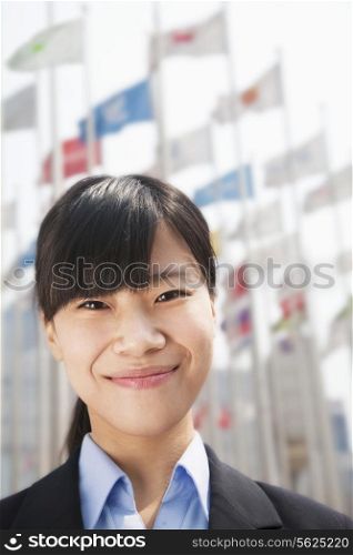 Close- up portrait of smiling young businesswoman