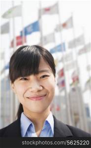 Close- up portrait of smiling young businesswoman