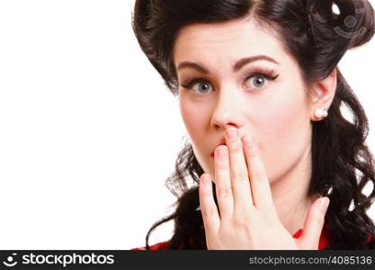 Close-up portrait of surprised attractive pinup girl covering her mouth by the hands, over white background
