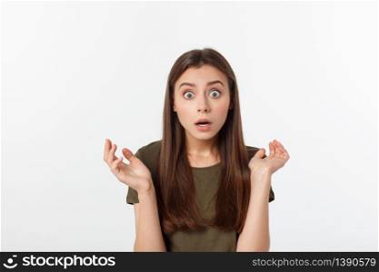 Close-up portrait of surprised beautiful girl holding her head in amazement and open-mouthed. Over white background.. Close-up portrait of surprised beautiful girl holding her head in amazement and open-mouthed. Over white background