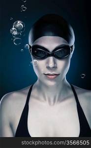 close-up portrait of swimmer in black with bubbles