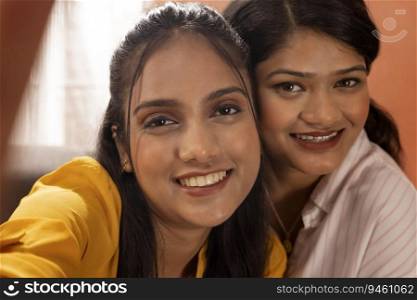 Close-up portrait of two happy young women