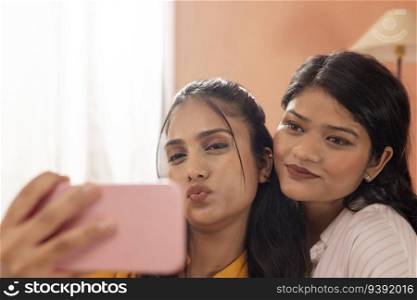 Close-up portrait of two young women taking selfie together