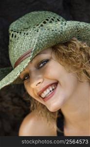 Close up portrait of young adult female Caucasian in hat.