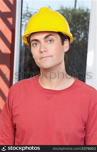 Close-up portrait of young architect wearing hard hat