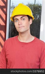 Close-up portrait of young architect wearing hard hat