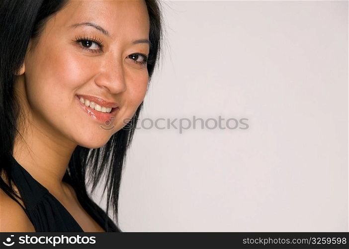 Close-up portrait of young Asian woman.