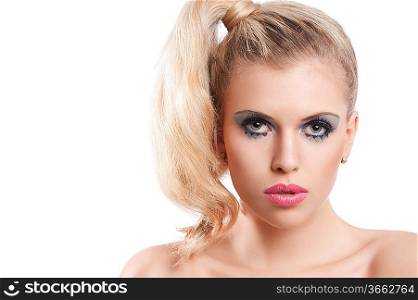 Close-up portrait of young beautiful blond woman with hair tail stylish and creative make up against white background