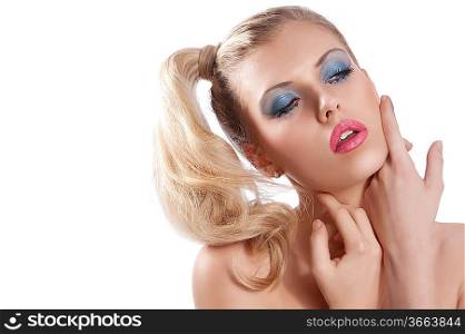 Close-up portrait of young beautiful blond woman with hair tail stylish and creative make up with sexy pose against while background