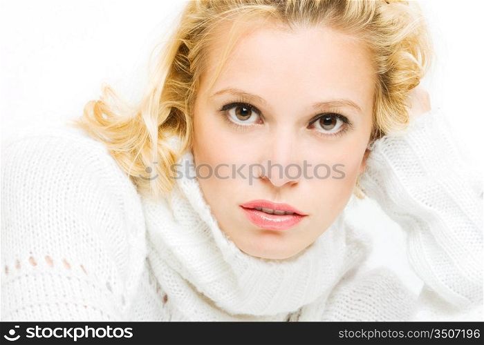 close up portrait of young blonde in white sweater