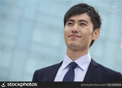 Close-up portrait of young businessman, China