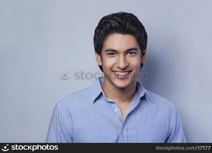 Close-up portrait of young man smiling