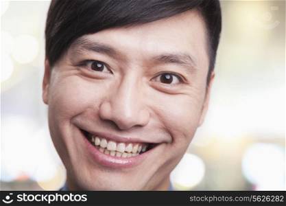 Close up portrait of young man smiling, Beijing