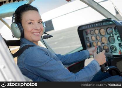 close up portrait of young woman helicopter pilot