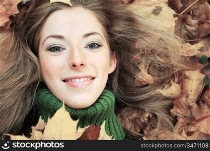 close-up portrait of young woman in autumnal park