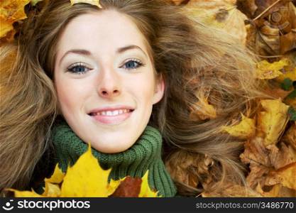 close-up portrait of young woman in autumnal park