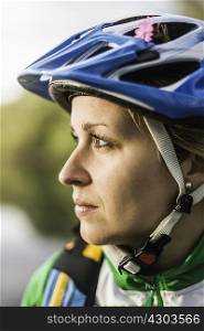 Close up portrait of young woman in cycling helmet, Augsburg, Bavaria, Germany