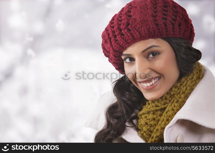 Close-up portrait of young woman in warm clothes
