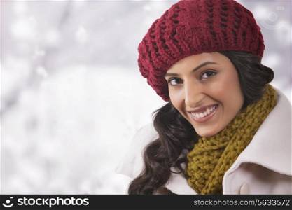 Close-up portrait of young woman in warm clothes