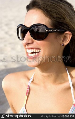 Close up portrait of young woman on beach