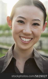 Close-up portrait of young woman outside, Beijing