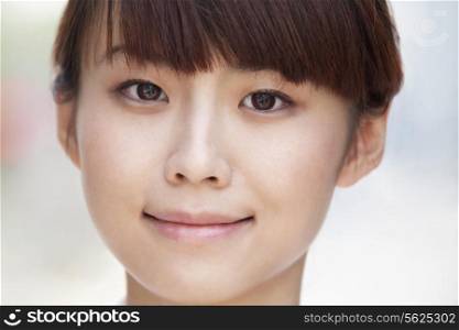 Close-up portrait of young woman smiling in Beijing