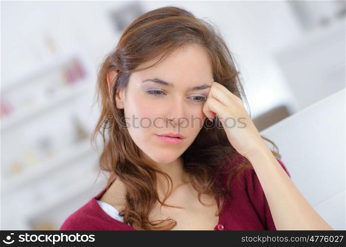 close up portrait of young woman with headache