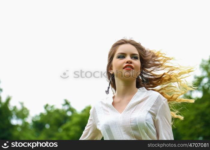 Close up Portrait, Young beautiful blonde woman posing outdoors in sunny weather