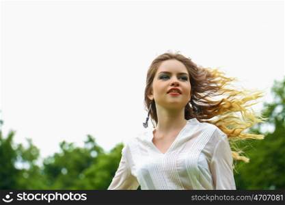 Close up Portrait, Young beautiful blonde woman posing outdoors in sunny weather