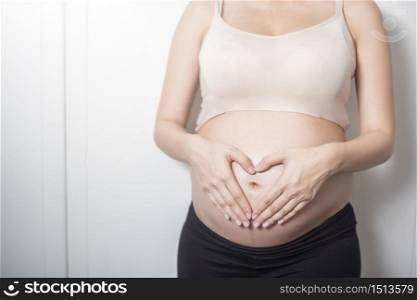 Close up pregnant woman expecting a baby