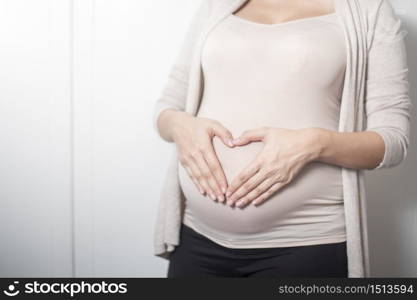 Close up pregnant woman expecting a baby