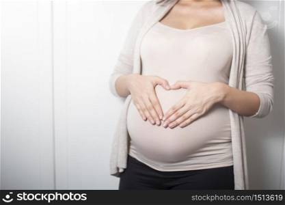 Close up pregnant woman expecting a baby