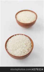 close up raw jasmine rice bowls white wallpaper