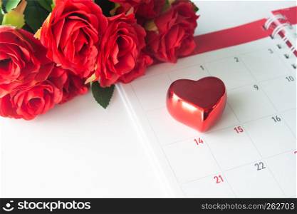 Close up red heart on calendar with red rose, Valentine concept