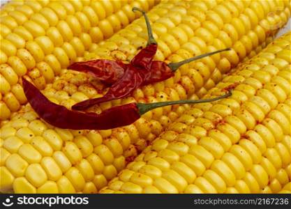 close up red hot chilli peppers with corn