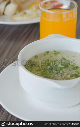 close up Rice soup with mince pork and vegetable in white bowl. asian rice soup