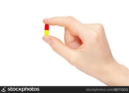 close up round white pill in hand