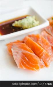 close up salmon sashimi with wasabi sauce , japanese style cuisine