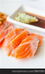 close up salmon sashimi with wasabi sauce , japanese style cuisine