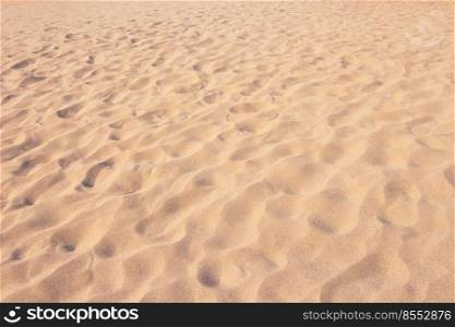 close up sand texture pattern background of a beach in the summer
