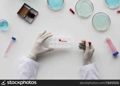close up scientist holding pipette